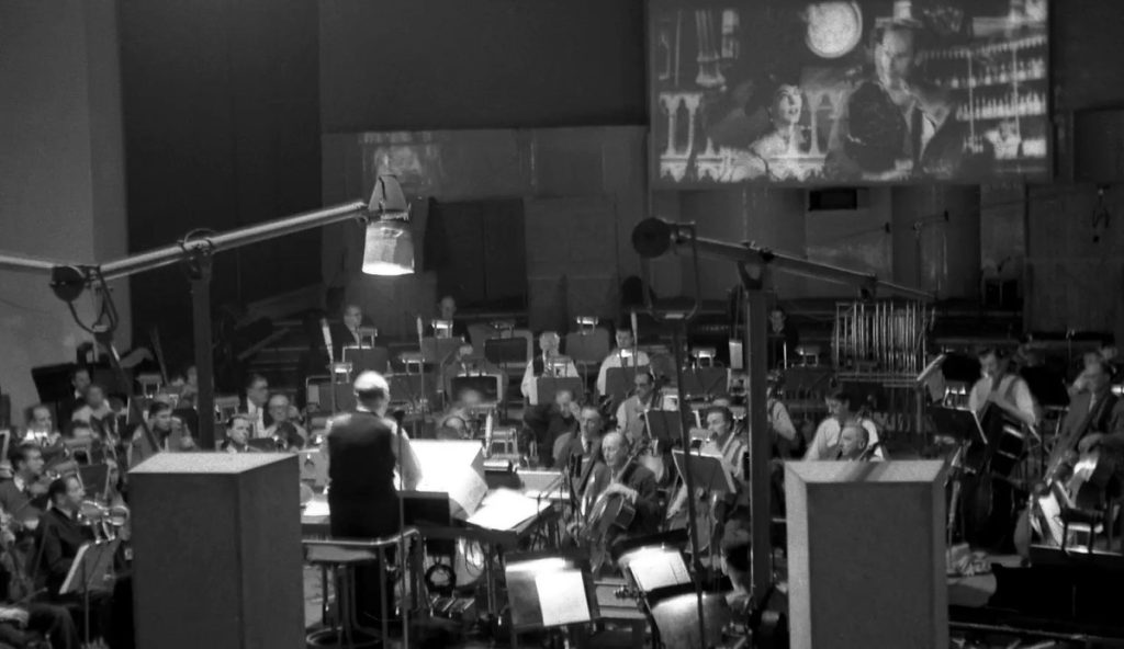 Dimitri-Tiomkin-and-orchestra-55-Days-at-Peking